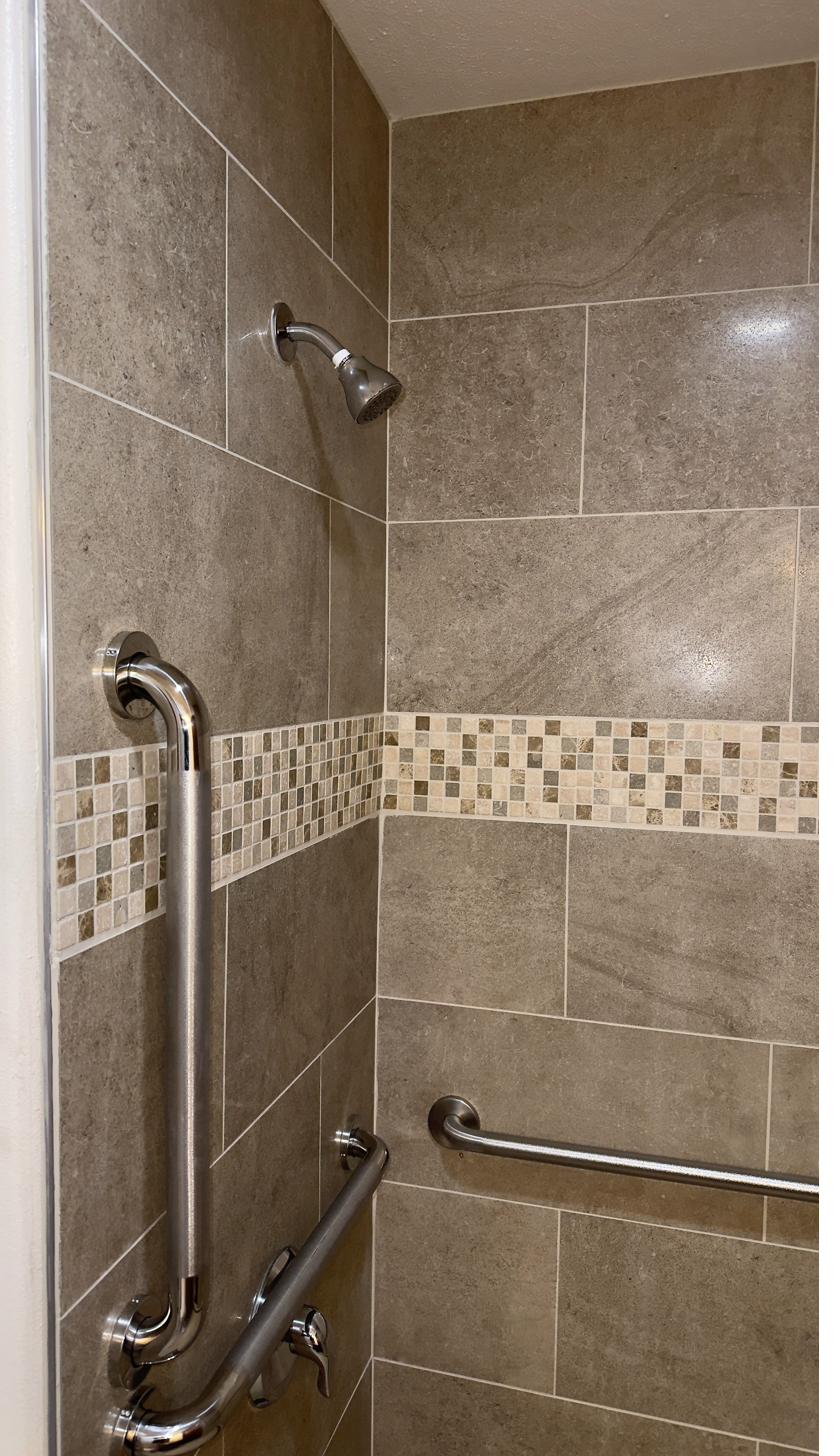 Custom tile shower with pebble floor